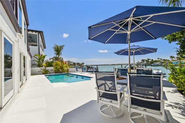 2233 Donato Dr, Belleair Beach, FL 33786 - outdoor pool with a water view and a patio area