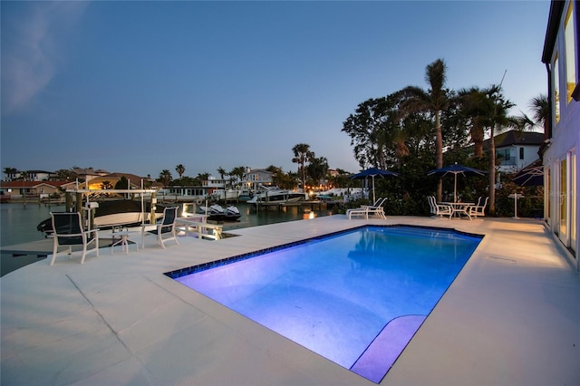 2233 Donato Dr, Belleair Beach, FL 33786 - outdoor pool featuring a patio area, a water view, and a dock