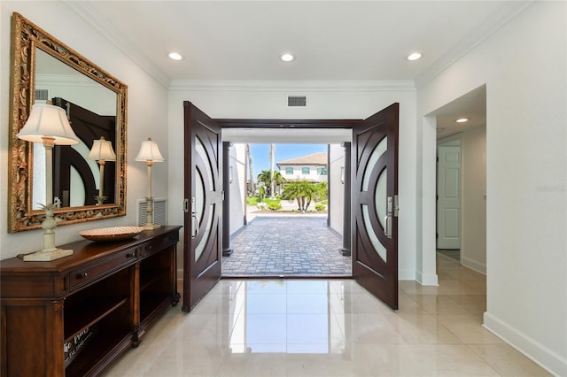 2233 Donato Dr, Belleair Beach, FL 33786 - entrance foyer featuring crown molding, visible vents, baseboards, and recessed lighting