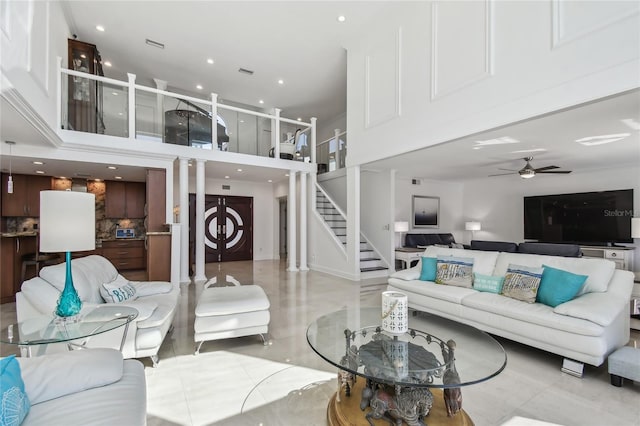 2233 Donato Dr, Belleair Beach, FL 33786 - living area featuring a ceiling fan, recessed lighting, visible vents, a towering ceiling, and stairs