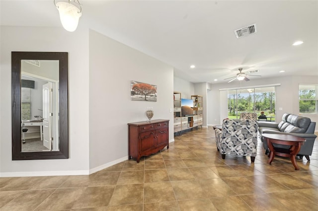 living area with recessed lighting, light tile patterned floors, ceiling fan, baseboards, and visible vents