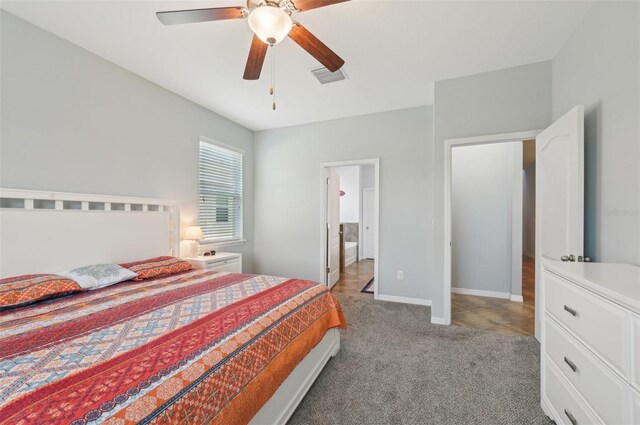 bedroom with baseboards, visible vents, a ceiling fan, and light carpet