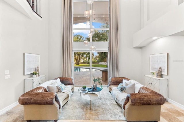 1600 Magnolia Rd, Belleair, FL 33756 - living area with a high ceiling and baseboards