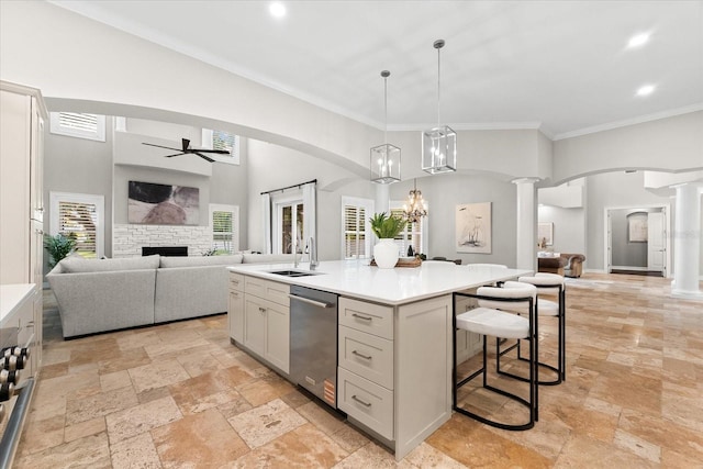 1600 Magnolia Rd, Belleair, FL 33756 - kitchen with dishwasher, a stone fireplace, stone tile flooring, open floor plan, and a ceiling fan