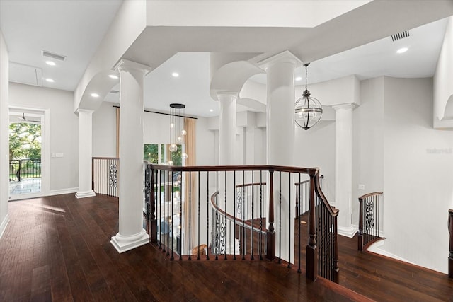 1600 Magnolia Rd, Belleair, FL 33756 - corridor featuring an upstairs landing, hardwood / wood-style floors, baseboards, and decorative columns
