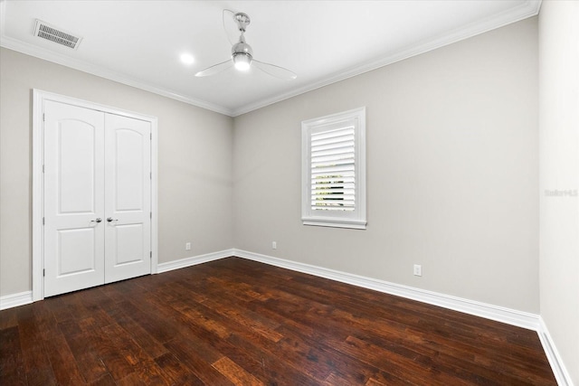 1600 Magnolia Rd, Belleair, FL 33756 - unfurnished bedroom with dark wood finished floors, baseboards, a closet, ornamental molding, and ceiling fan