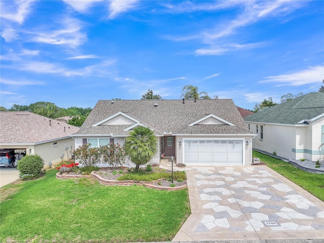 ranch-style home featuring a front lawn, driveway, a garage, and roof with shingles