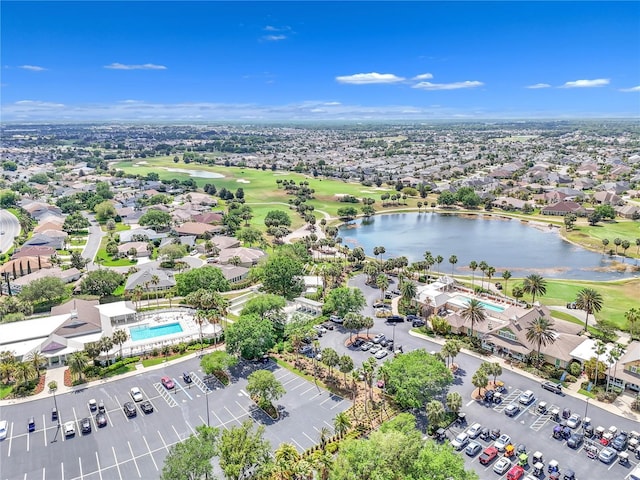 birds eye view of property featuring a water view and view of golf course