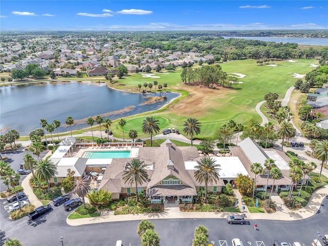 birds eye view of property featuring a residential view, view of golf course, and a water view