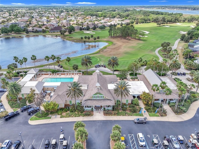 birds eye view of property featuring a residential view, a water view, and golf course view