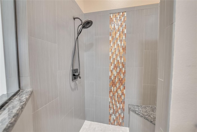 bathroom featuring tiled shower