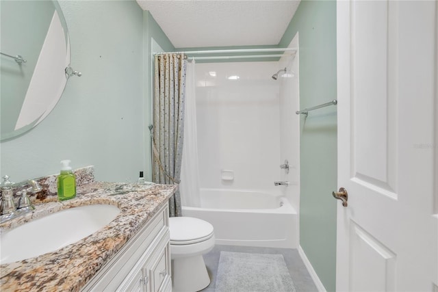 bathroom featuring shower / bath combo with shower curtain, toilet, a textured ceiling, and vanity