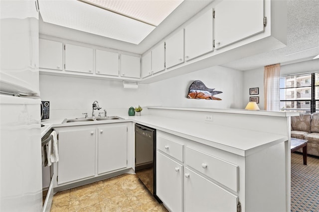 kitchen featuring black dishwasher, a peninsula, white cabinetry, and a sink