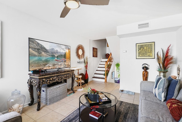 4306 La Mora Ct, Tampa, FL 33611 - living room with stairway, ceiling fan, light tile patterned floors, and visible vents