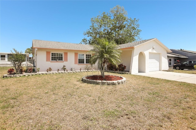 ranch-style home featuring driveway, a front lawn, stucco siding, and an attached garage