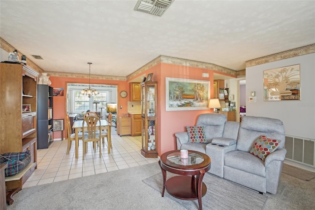 living room with a chandelier, visible vents, and light tile patterned floors