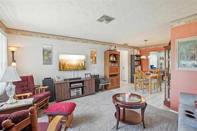 living area featuring light tile patterned floors, a notable chandelier, a textured ceiling, and visible vents