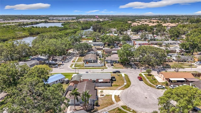 bird's eye view with a residential view and a water view