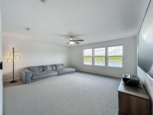 17683 Ramble On Way, Land O Lakes, FL 34638 - living room featuring ceiling fan, visible vents, baseboards, and carpet