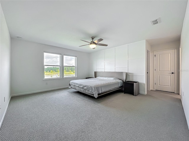 17683 Ramble On Way, Land O Lakes, FL 34638 - bedroom with baseboards, visible vents, light carpet, and ceiling fan