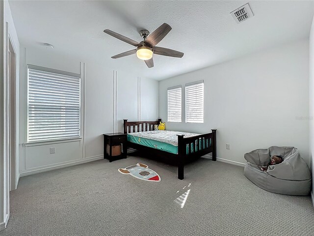 17683 Ramble On Way, Land O Lakes, FL 34638 - bedroom with carpet floors, baseboards, a ceiling fan, and visible vents