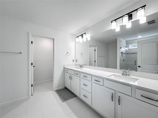 17683 Ramble On Way, Land O Lakes, FL 34638 - full bathroom featuring a sink, a stall shower, double vanity, and visible vents