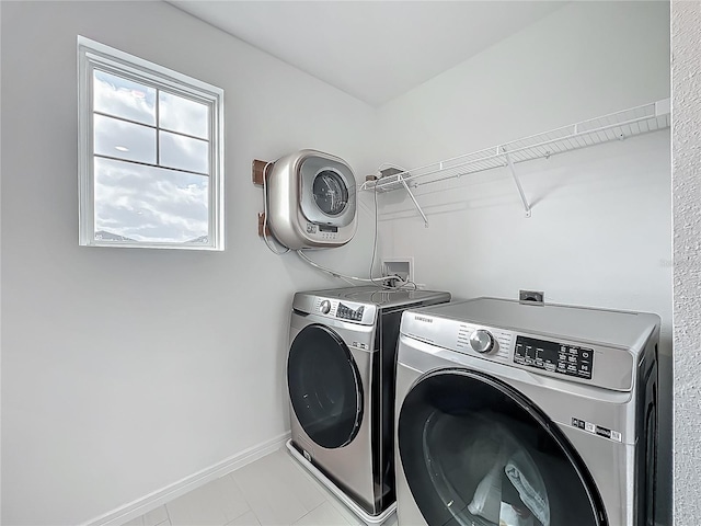 17683 Ramble On Way, Land O Lakes, FL 34638 - laundry room featuring laundry area, baseboards, and washer and dryer