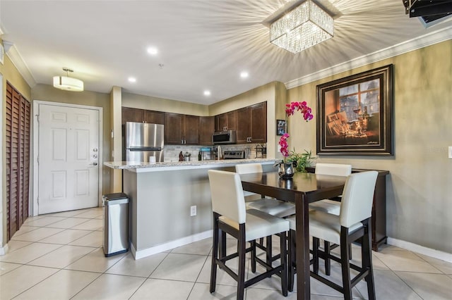 2400 Feather Sound Dr Unit 735, Clearwater, FL 33762 - dining room with light tile patterned flooring, baseboards, recessed lighting, and ornamental molding
