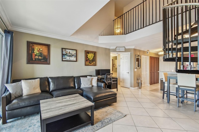 2400 Feather Sound Dr Unit 735, Clearwater, FL 33762 - living area with tile patterned flooring, ornamental molding, baseboards, and a towering ceiling