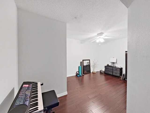 2400 Feather Sound Dr Unit 735, Clearwater, FL 33762 - misc room with baseboards, a ceiling fan, a textured ceiling, and wood finished floors