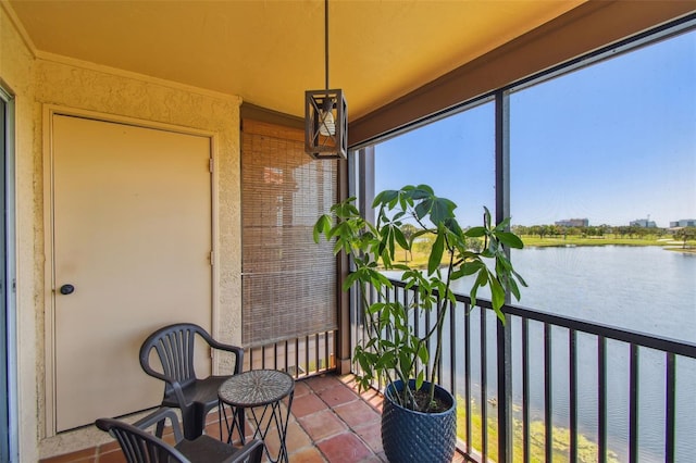 2400 Feather Sound Dr Unit 735, Clearwater, FL 33762 - sunroom / solarium featuring a water view and tile patterned floors