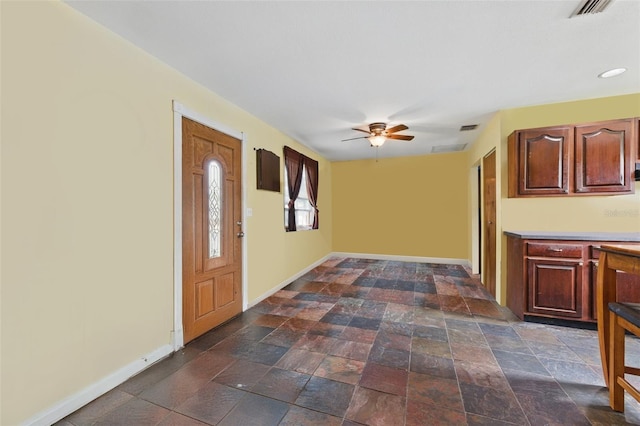 4100 1st Ave S, Saint Petersburg, FL 33711 - foyer with visible vents, baseboards, a ceiling fan, and stone finish floor