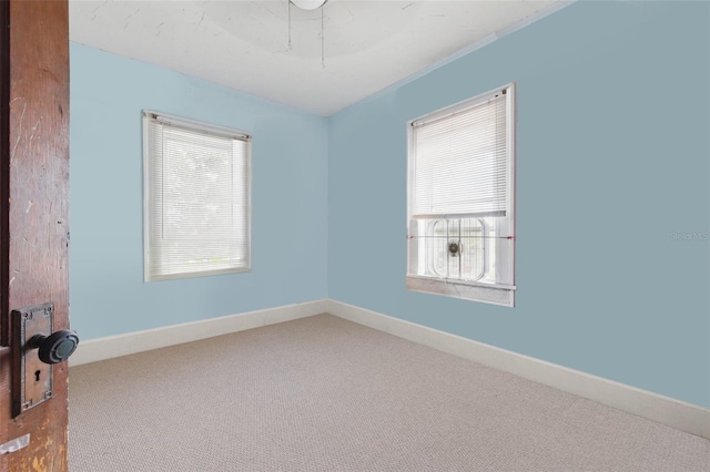 4100 1st Ave S, Saint Petersburg, FL 33711 - unfurnished room featuring baseboards and carpet floors