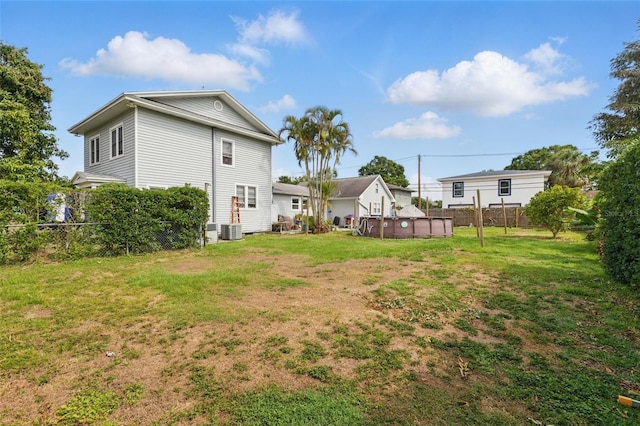 4100 1st Ave S, Saint Petersburg, FL 33711 - view of yard with central air condition unit, a fenced in pool, and fence