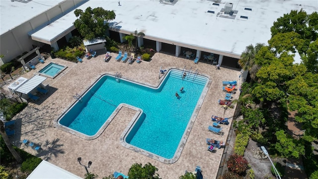 community pool with a patio area