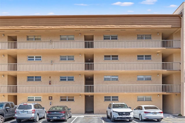 view of property with uncovered parking
