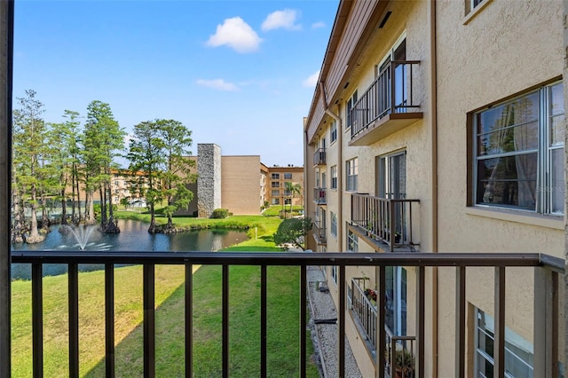 balcony featuring a water view
