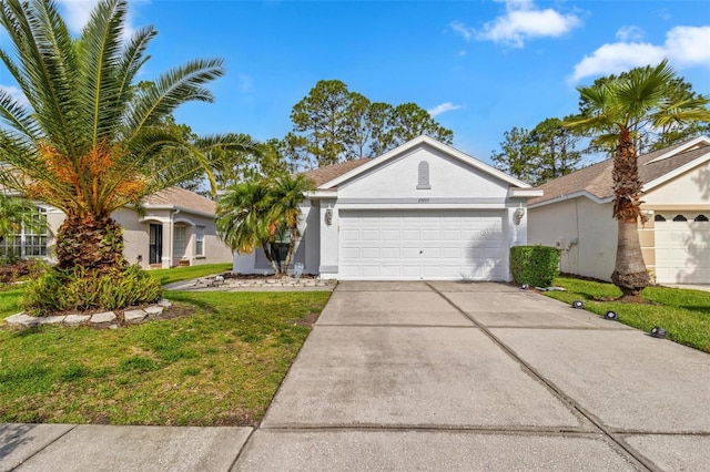 23935 Coral Ridge Ln, Land O Lakes, FL 34639 - ranch-style home featuring a garage, stucco siding, driveway, and a front lawn