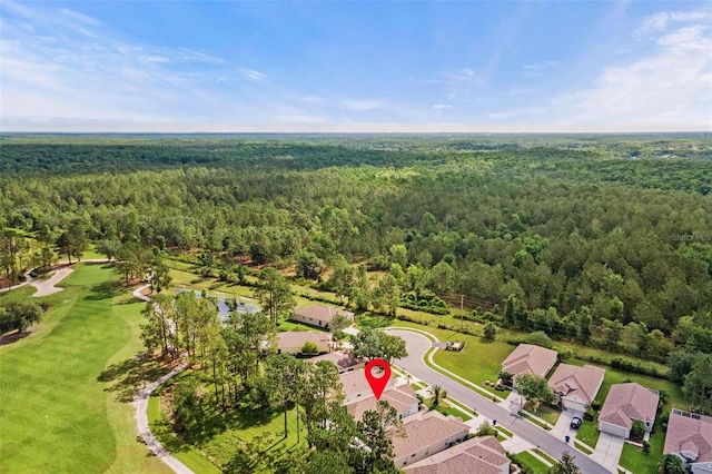 23935 Coral Ridge Ln, Land O Lakes, FL 34639 - aerial overview of property's location with a heavily wooded area, a local golf course, and nearby suburban area