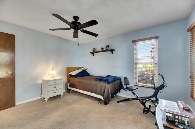 bedroom featuring ceiling fan, carpet flooring, and baseboards