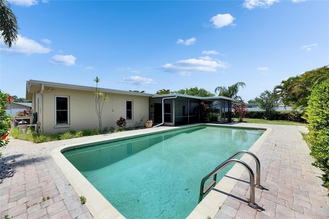 outdoor pool featuring a sunroom