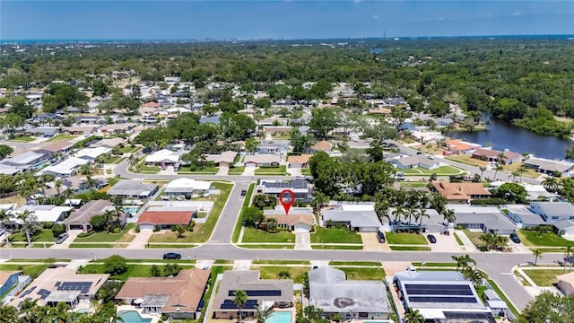 birds eye view of property featuring a residential view and a water view