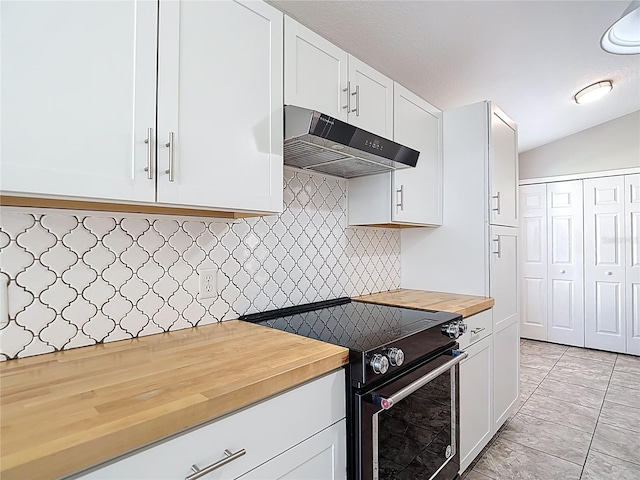 kitchen with butcher block counters, white cabinetry, black electric range, and under cabinet range hood