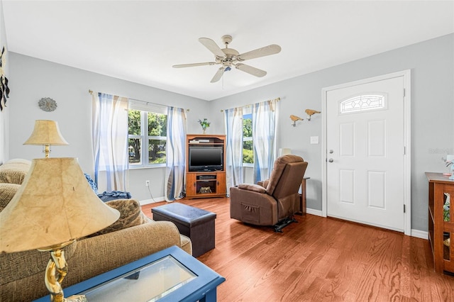 2134 6th Ave N, Saint Petersburg, FL 33713 - living area featuring baseboards, a ceiling fan, and wood finished floors