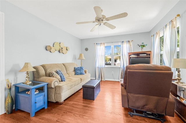 2134 6th Ave N, Saint Petersburg, FL 33713 - living room with baseboards, a ceiling fan, and wood finished floors