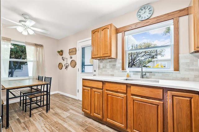 2134 6th Ave N, Saint Petersburg, FL 33713 - kitchen with light countertops, plenty of natural light, a sink, and tasteful backsplash
