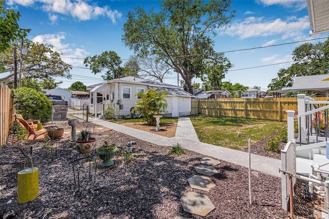 2134 6th Ave N, Saint Petersburg, FL 33713 - view of yard with an outdoor structure, a patio, and a fenced backyard