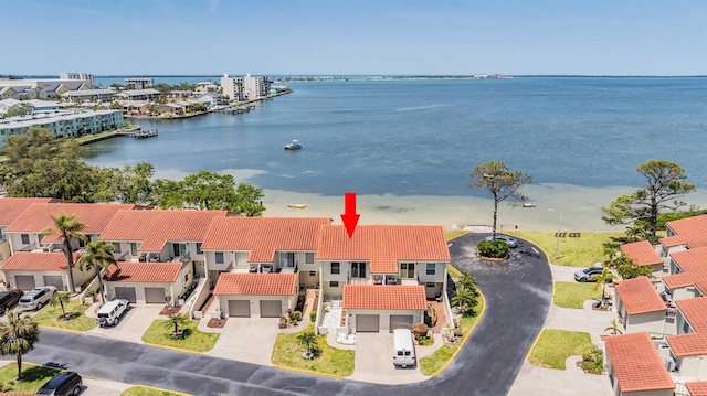 bird's eye view with a water view and a residential view