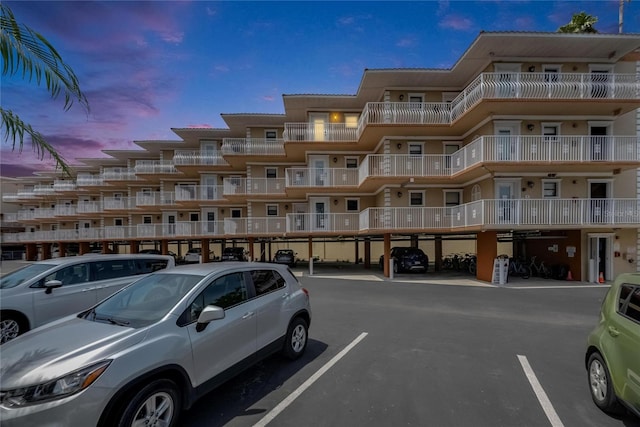 1420 Bayshore Blvd Unit 409, Dunedin, FL 34698 - view of apartment building / complex featuring covered and uncovered parking