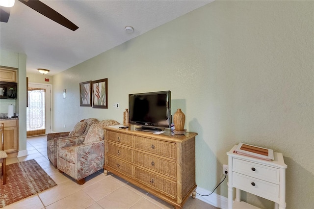 1420 Bayshore Blvd Unit 409, Dunedin, FL 34698 - living area with ceiling fan and light tile patterned floors